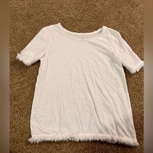 2 white tees, one with ruffles